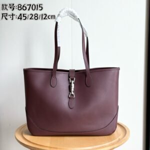 GG Jackie Medium Tote Bag in textured burgundy leather.